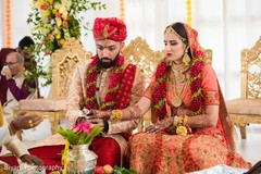 Indian bride and groom lighting up agni. Indian bride and groom lighting up agni.