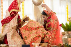 Indian groom pouring rice into maharanis head. Indian groom pouring rice into maharanis head.