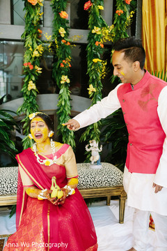 Indina birde at haldi holding two bananas. Indina birde at haldi holding two bananas.