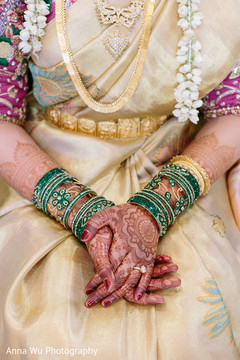 Indian bride wearing her golden and green chooras. Indian bride wearing her golden and green chooras.