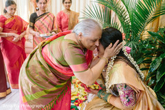 Relative hugging maharani at haldi ritual. Relative hugging maharani at haldi ritual.