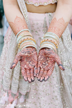 Indian bride showing her mehndi art and her diamond chooras. Indian bride showing her mehndi art and her diamond chooras.