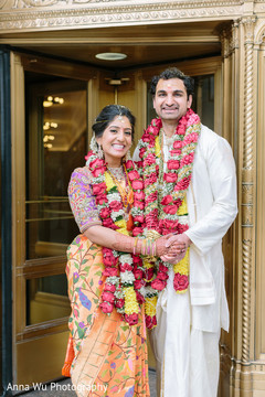 Indian couple in their ceremony orange saree and white kurta. Indian couple in their ceremony orange saree and white kurta.