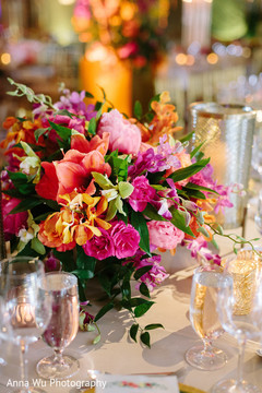 Orange and pink indian wedding table flowers. Orange and pink indian wedding table flowers.