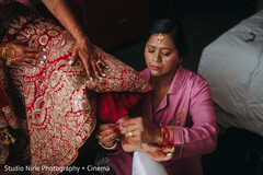 Maharani getting her anklets on. Maharani getting her anklets on.