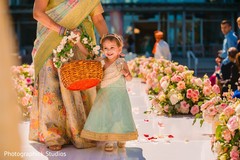 Lovely indian flower girl in her aqua lehenga. Lovely indian flower girl in her aqua lehenga.