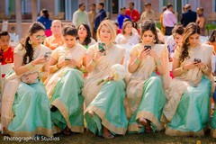 Indian bridesmaids in their golden ivory and aqua lehengas. Indian bridesmaids in their golden ivory and aqua lehengas.