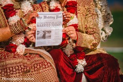 Indian couple holding the wedding News. Indian couple holding the wedding News.