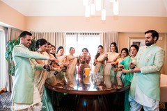 Indian bride with bridesmaids and groomsmen popping bottles. Indian bride with bridesmaids and groomsmen popping bottles.