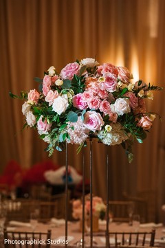 Indian wedding tall table roses centerpiece. Indian wedding tall table roses centerpiece.