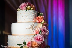 Indian wedding white cake with pink and orange roses. Indian wedding white cake with pink and orange roses.