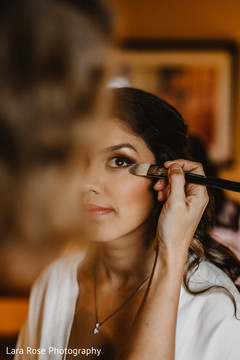 Indian bride getting her makeup done. Indian bride getting her makeup done.