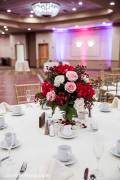 Indian wedding table pink roses and red flowers decoration. Indian wedding table pink roses and red flowers decoration.