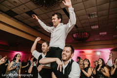 Indian groom lifted at wedding reception. Indian groom lifted at wedding reception.