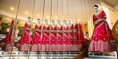 Indian bride walking down the stairs with red lehenga. Indian bride walking down the stairs with red lehenga.