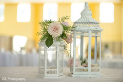 Light pink roses with white lanterns indian wedding table decoration. Light pink roses with white lanterns indian wedding table decoration.