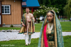 Groom approaching his bride during first look photoshoot Groom approaching his bride during first look photoshoot