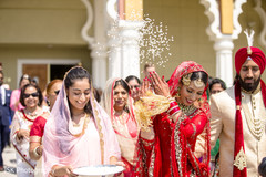 Indian bride throwing rice back. Indian bride throwing rice back.
