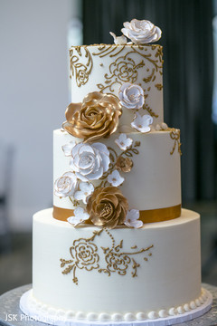 White and golden Indian wedding cake decorations. White and golden Indian wedding cake decorations.