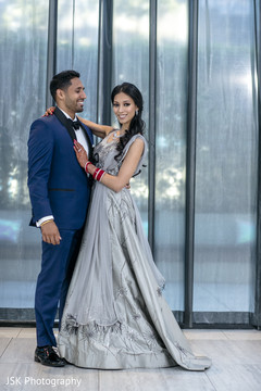 Indian couple posing for reception photo session. Indian couple posing for reception photo session.