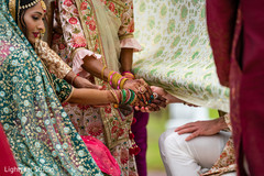 Indian bride and groom holding hands close up Indian bride and groom holding hands close up