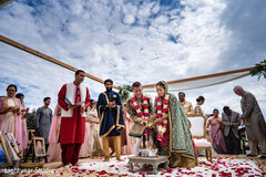Indian couple making offerings to sacred fire Indian couple making offerings to sacred fire