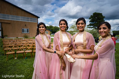 Indian bridesmaids holding shoe Indian bridesmaids holding shoe