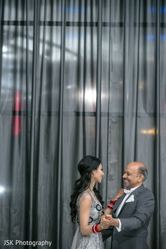 Indian bride with father at reception dance. Indian bride with father at reception dance.