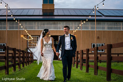 Adorable indian couple walking holding hands Adorable indian couple walking holding hands