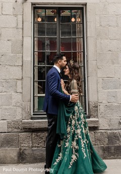 Handsome Indian groom kissing bride in the forehead Handsome Indian groom kissing bride in the forehead