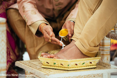 Indian groom getting his feet washed with milk. Indian groom getting his feet washed with milk.