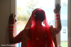 Indian bride looking out the window. Indian bride looking out the window.