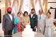 Indian couple with relatives at wedding reception. Indian couple with relatives at wedding reception.
