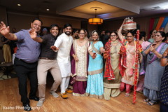 Indian couple with relatives at sangeet celebration. Indian couple with relatives at sangeet celebration.