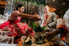 Indian couple pouring offerings to Agni. Indian couple pouring offerings to Agni.
