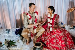 Indian groom putting ring to bride. Indian groom putting ring to bride.