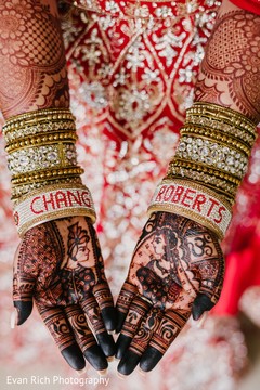 Indian bridal henna art and golden bangles. Indian bridal henna art and golden bangles.