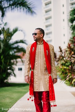 Indian groom walking in his ceremony outfit. Indian groom walking in his ceremony outfit.