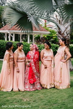 Maharani in her red lehenga and bridesmaids. Maharani in her red lehenga and bridesmaids.