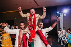 Indian groom lifted by groomsmen. Indian groom lifted by groomsmen.