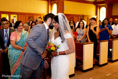 Bride meeting groom at the altar during the Christian ceremony Bride meeting groom at the altar during the Christian ceremony