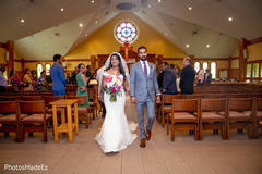 Indian couple leaving the Christian wedding ceremony Indian couple leaving the Christian wedding ceremony