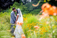 Lovely Indian groom kissing bride photo session. Lovely Indian groom kissing bride photo session.