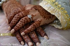 Close captured of bridal Mehndi and wedding ring. Close captured of bridal Mehndi and wedding ring.