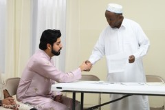 Indian groom ready to sigh the marriage certificate Indian groom ready to sigh the marriage certificate