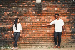 Adorable capture of Indian bride and groom having fun at photo session Adorable capture of Indian bride and groom having fun at photo session