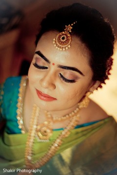 Glamorous Indian bride showcasing her gorgeous makeup. Glamorous Indian bride showcasing her gorgeous makeup.