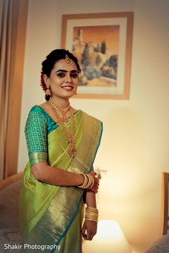 Sweet Indian bride posing while getting ready for her big day Sweet Indian bride posing while getting ready for her big day