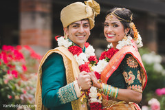 Indian bride and groom with garlands Indian bride and groom with garlands
