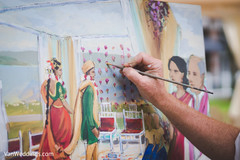 Fantastic shot of live painter immortalizing the wedding ceremony. Fantastic shot of live painter immortalizing the wedding ceremony.